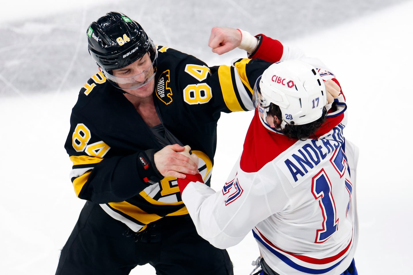 Bruins winger Tanner Jeannot (left) and the Canadiens' Josh Anderson didn't waste any time engaging in hostilities, dropping the gloves right after the puck drop of Tuesday night's game between old rivals at TD Garden.