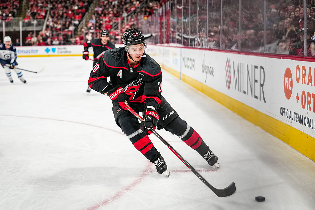 RALEIGH, NORTH CAROLINA - NOVEMBER 28: Sebastian Aho #20 of the Carolina Hurricanes skates with the puck during the first period of a game against the Winnipeg Jets at Lenovo Center on November 28, 2025 in Raleigh, North Carolina. (Photo by Josh Lavallee/NHLI via Getty Images)