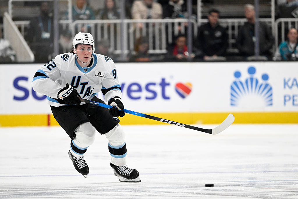 SAN JOSE, CALIFORNIA - DECEMBER 01: Logan Cooley #92 of the Utah Mammoth controls the puck against the San Jose Sharks in the third period at SAP Center on December 01, 2025 in San Jose, California. (Photo by Eakin Howard/Getty Images)