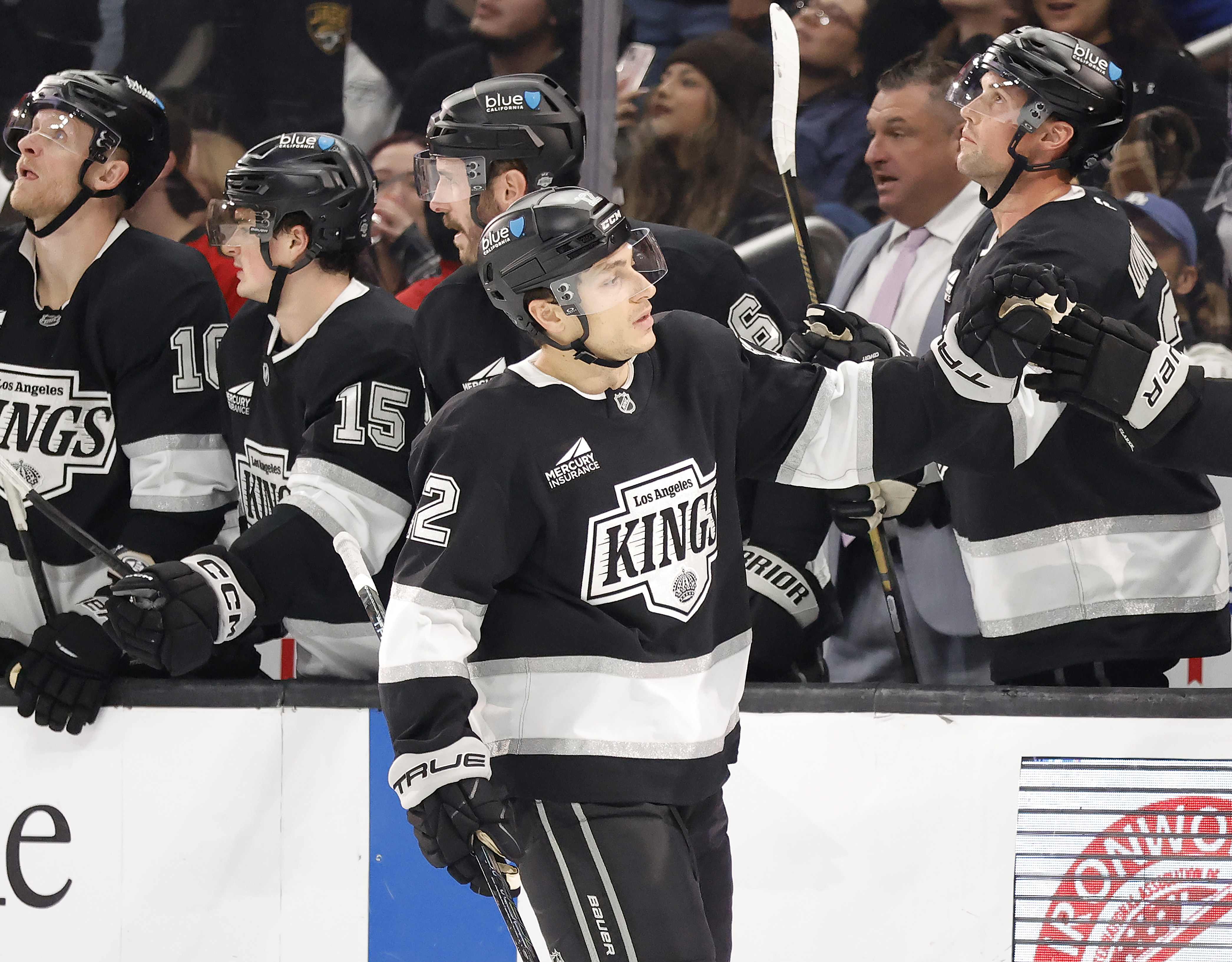 The Kings’ Trevor Moore (12) celebrates his goal with the...