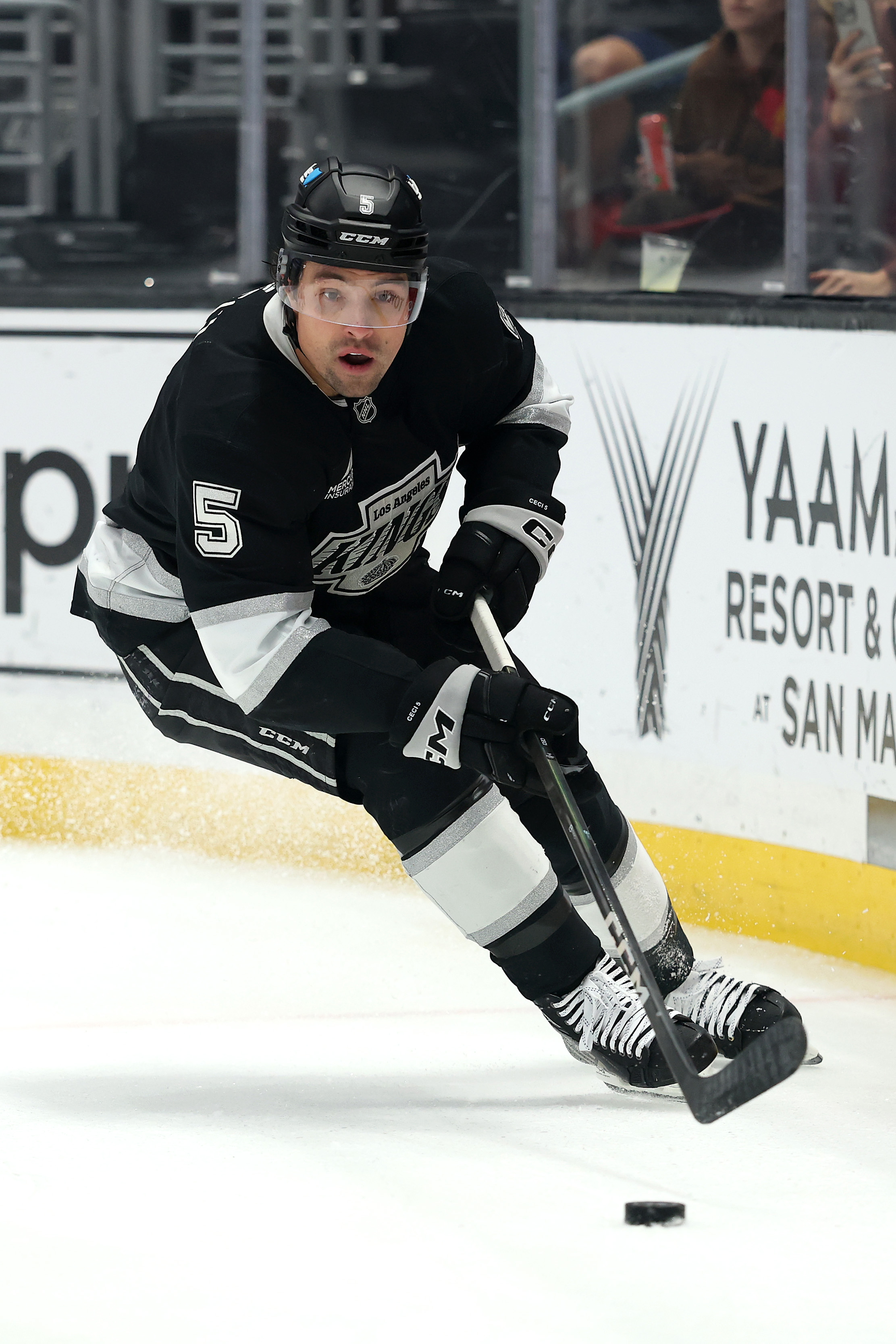 The Kings’ Cody Ceci skates with the puck during the...