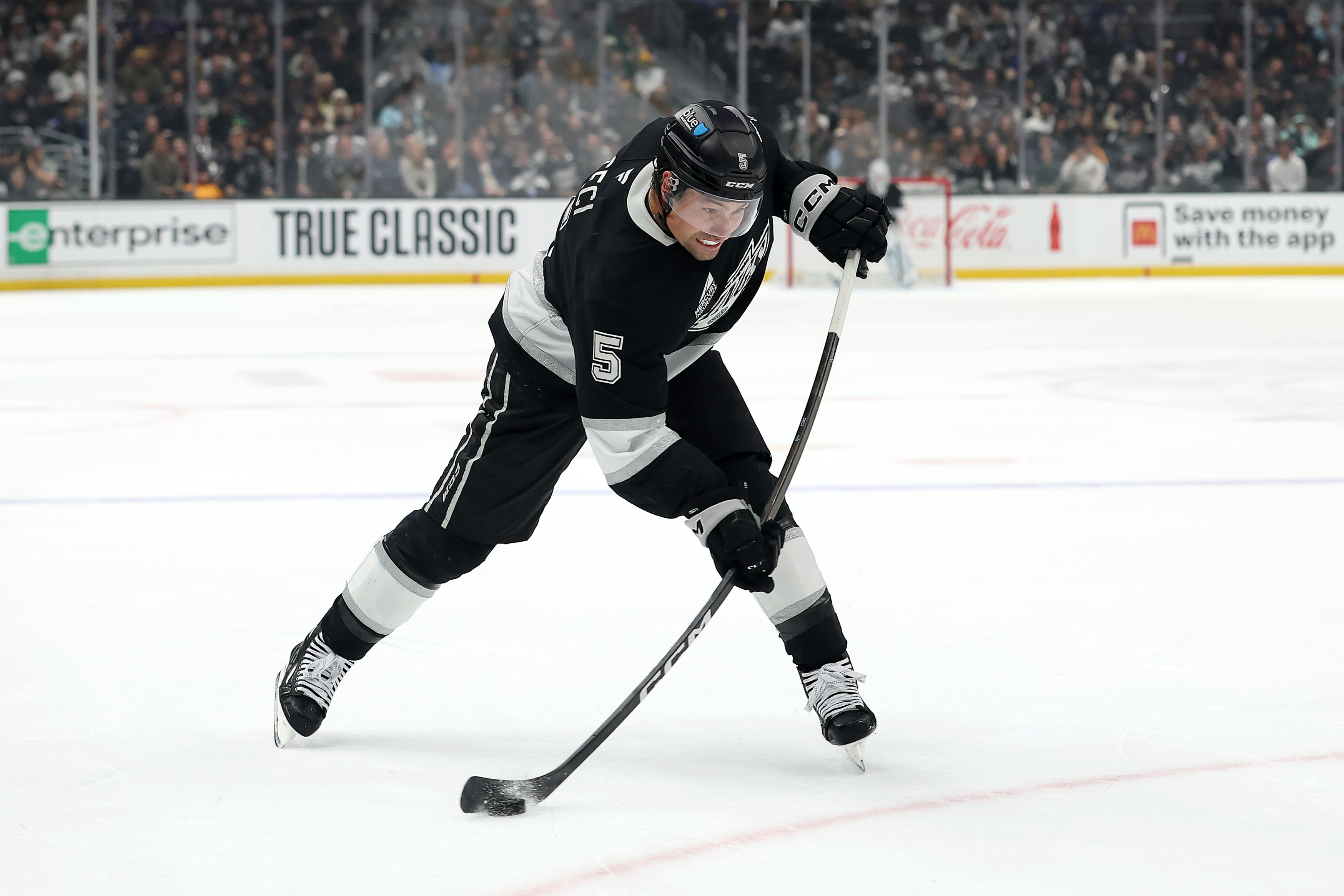 Kings defenseman Cody Ceci shoots the puck during the second...