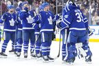 Teammates line up to congratulate Toronto Maple Leafs goaltender Dennis Hildeby (35) after his shut-out performance in their team's 2-0 win over the Tampa Bay Lightning following NHL hockey action in Toronto, Monday, Dec. 8, 2025. THE CANADIAN PRESS/Chris Young
