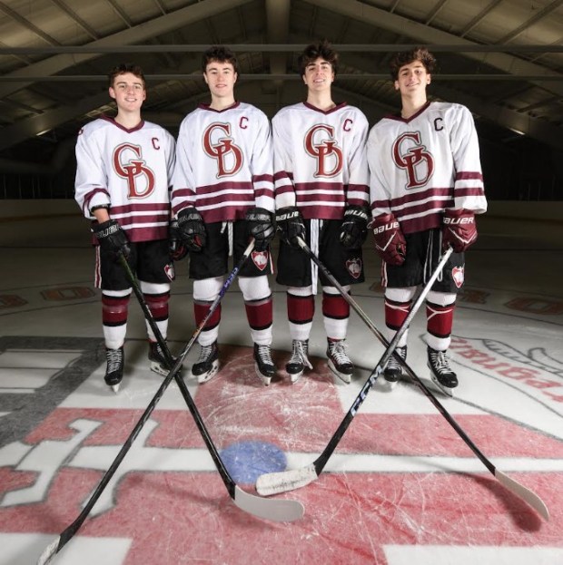 Captaining the Groton-Dunstable boys hockey team this season are, from left, Rob Flynn, Drew McKennon, Griffin Southwick and Brody Acucena. (Glen Shapland photo)