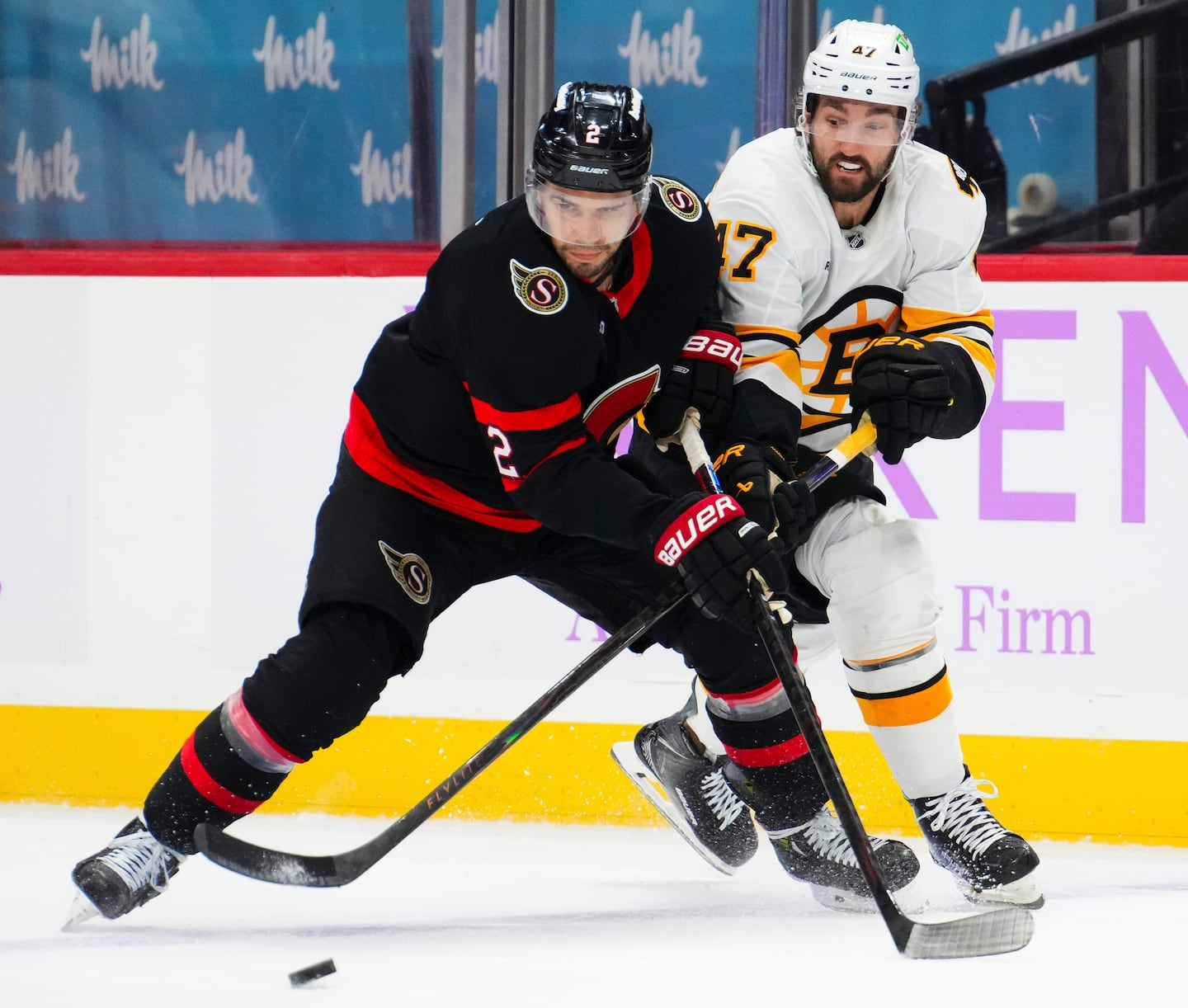 Bruins center-turned-winger Mark Kastelic (47) has acquitted himself quickly to fight for the puck in the corners, like here against hulking Ottawa defenseman Artem Zub last month.