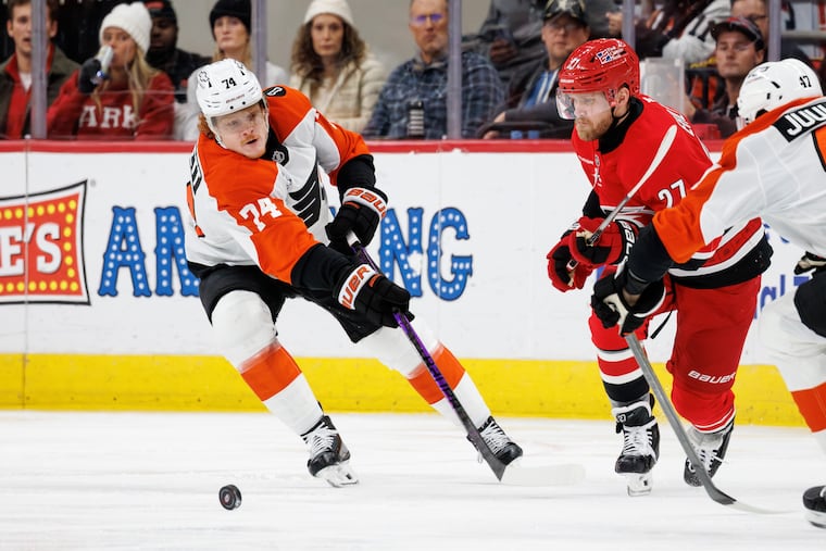 Flyers' Owen Tippett (left) chases after the puck against the Hurricanes on Sunday.