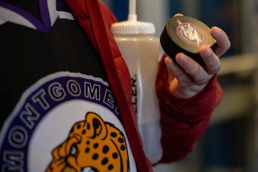 Benzi Goldman, team member from the Montgomery County Cheetahs, holds a puck signed by Alexander Ovechkin after playing alongside other members from The American Special Hockey Association, including teammates from the Montgomery County Cheetahs, at the Medstar Iceplex in Arlington, VA on December 10, 2025.