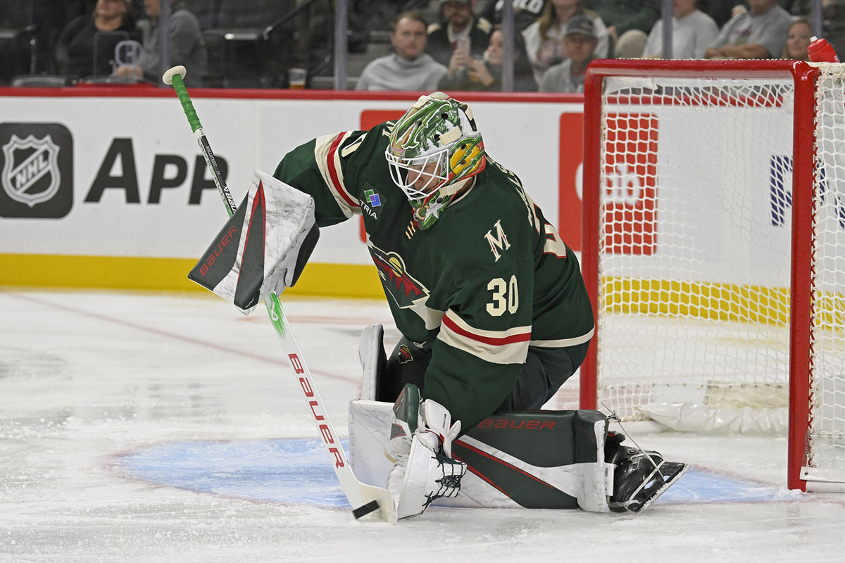 Minnesota Wild goalie Jesper Wallstedt (30) controls the puck against the Dallas Stars during the first period at Xcel Energy Center.