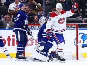 Canadiens forward Juraj Slafkovsky, right, celebrates a goal in the second period against the Maple Leafs at Scotiabank Arena in Toronto, Saturday, Dec. 6, 2025.