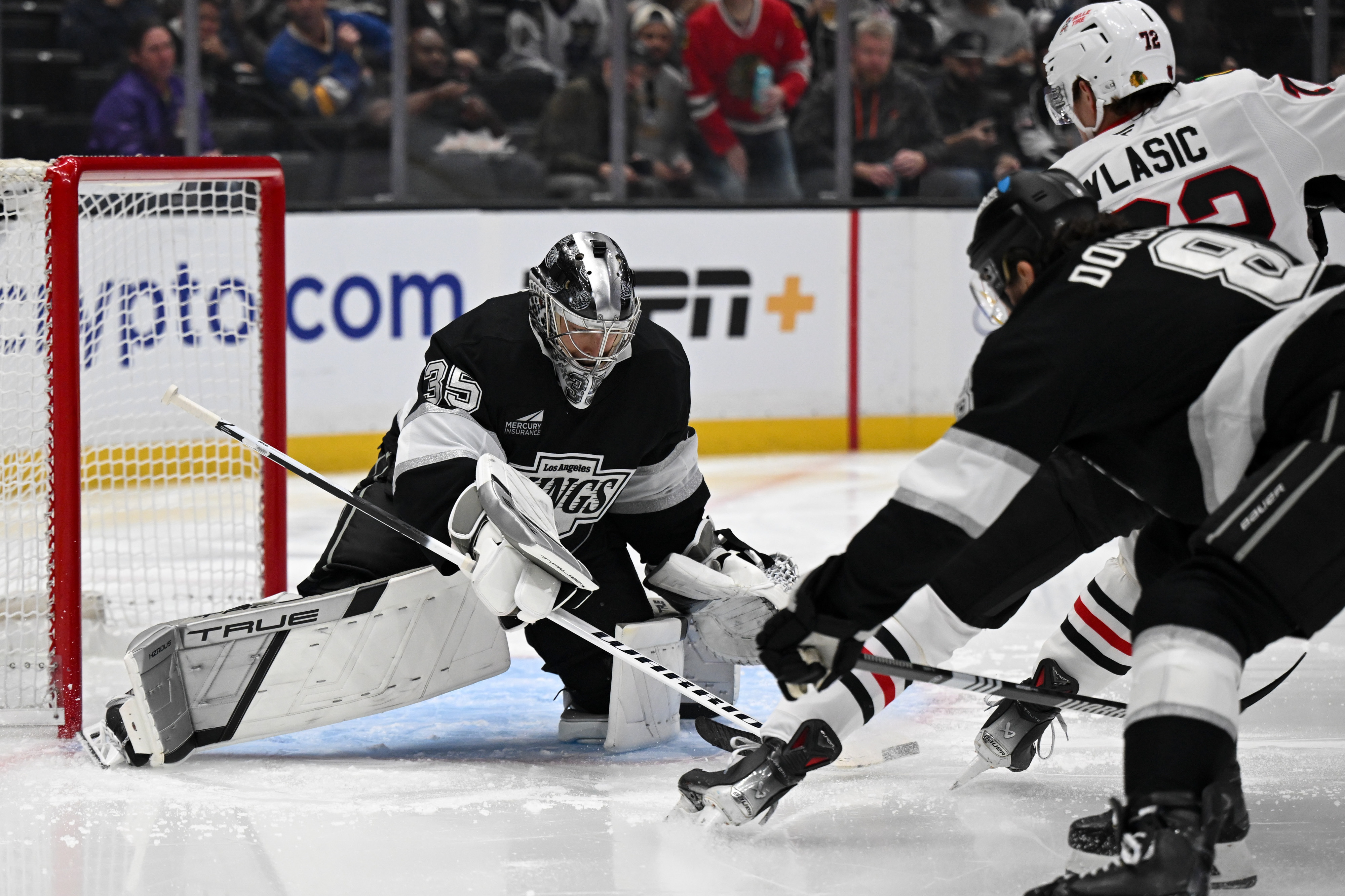 Kings goalie Darcy Kuemper (35) makes a save as Blackhawks...