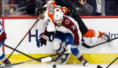 Philadelphia Flyers right wing Nikita Grebenkin collides with Colorado Avalanche defenseman Sam Malinski during the first period.