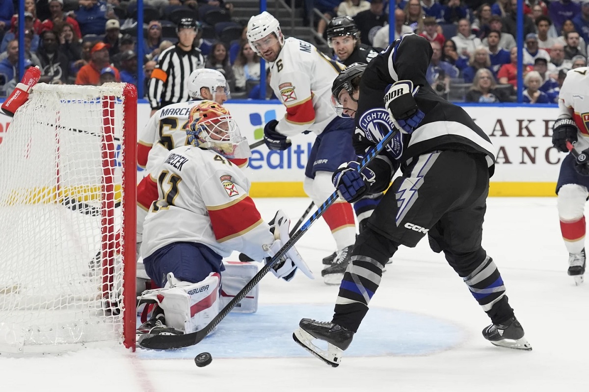 Florida Panthers goaltender Vitek Vanecek (41) makes a save on a shot by Tampa Bay Lightning center Brayden Point (21) during the second period of an NHL hockey game Tuesday, April 15, 2025, in Tampa, Fla. (AP Photo/Chris O'Meara)