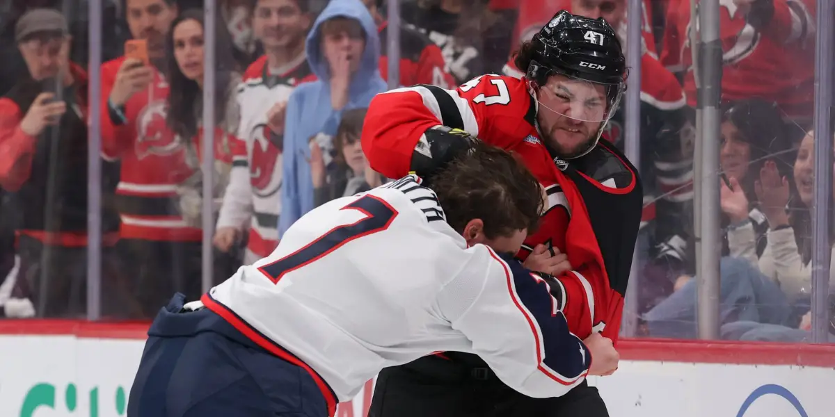 New Jersey Devils' Paul Cotter fights Brendan Smith in the second period of Monday's game against the Columbus Blue Jackets.