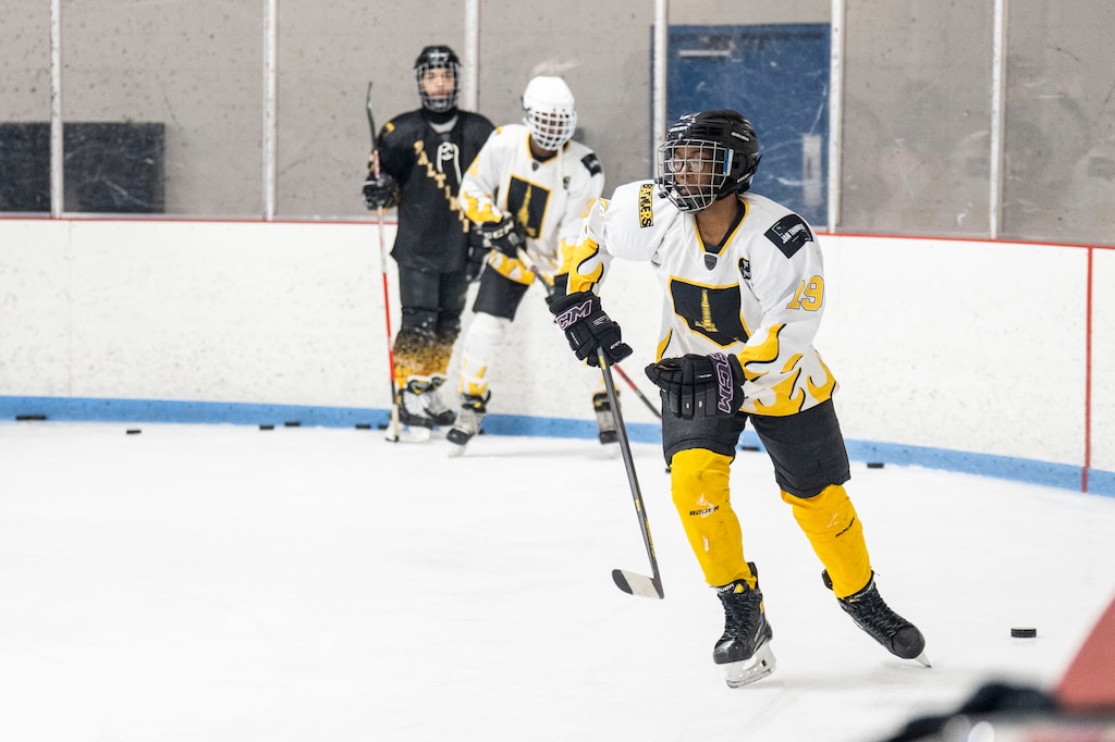 Loyalty Burrell a Baltimore Banner hockey player takes off while running drills with her teammates at Mt. Pleasant Ice Arena, in Baltimore, Saturday, December 20, 2025.
