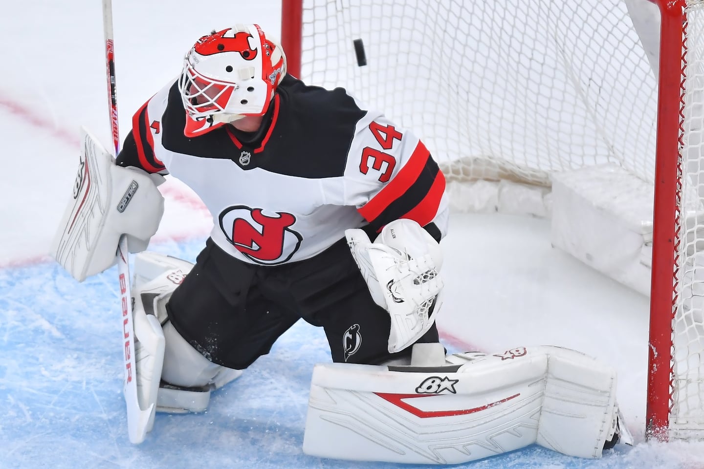 Devils goaltender Jake Allen tries to defend as a shot by the Bruins' Fraser Minten flies into the net for a goal in the first period.