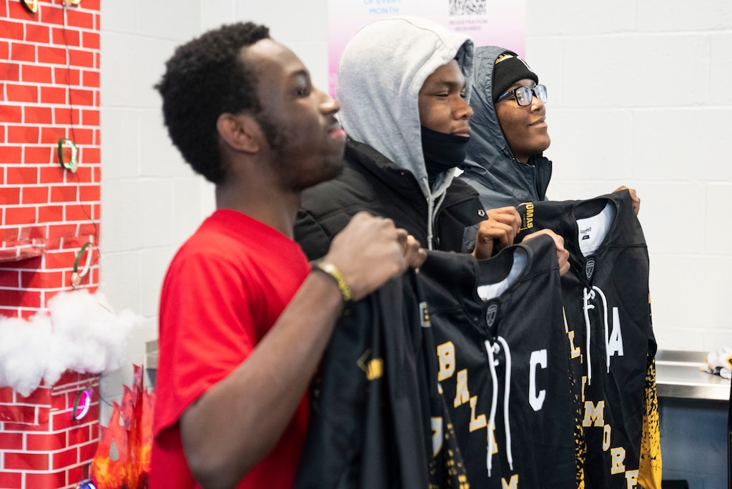 Loyalty Burrell, Donteze “Moo Moo” Branch and Larry Shanks-Leas all pose with their jerseys now marked with C for captains after Baltimore Banner Hockey practice at Mt. Pleasant Ice Arena, in Baltimore, Saturday, December 20, 2025.