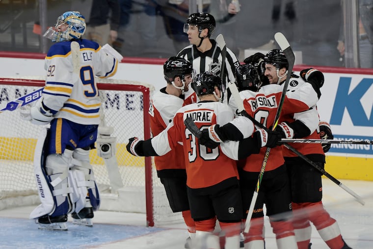 Flyers Noah Cates (far right) celebrates his goal in the second period of the Buffalo Sabres at Philadelphia Flyers NHL game at Xfinity Mobile Arena in Philadelphia on Wednesday, Dec. 3, 2025.