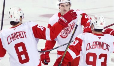 DeBrincat has 2 goals and an assist as Red Wings hold off Flames 4-3