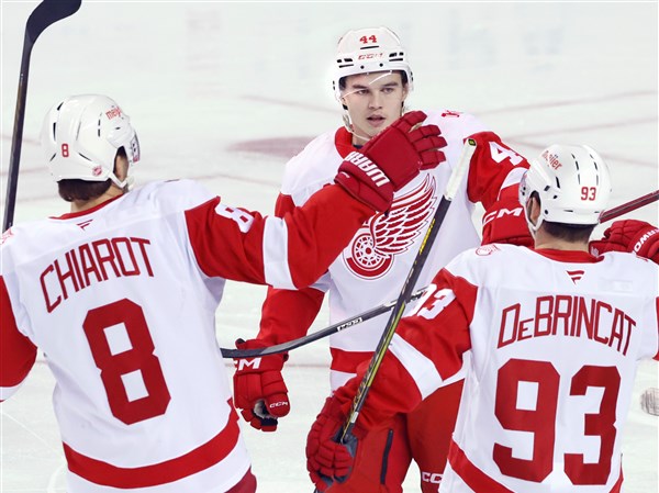 DeBrincat has 2 goals and an assist as Red Wings hold off Flames 4-3