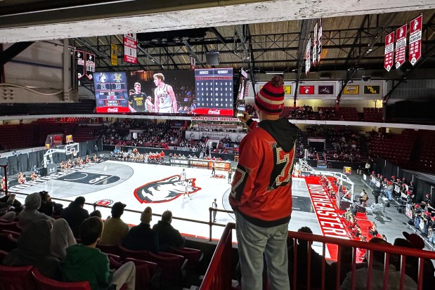 A fan watches a game at Matthews Arena in Boston