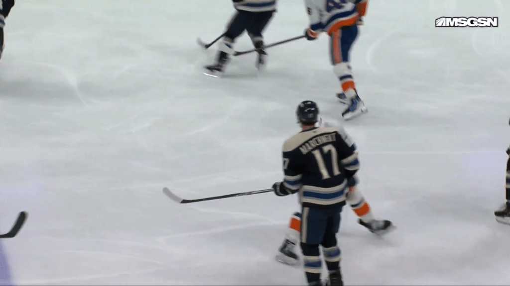 Mat Barzal winds up his stick to swing at Mason Marchment during a game on Sunday.
