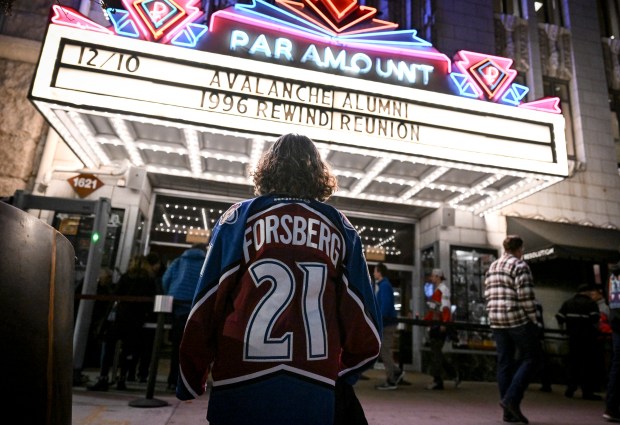 Carrie Fiore wears a Peter Forsberg Colorado Avalanche jersey as she waits beneath the marquee at the Paramount Theater in Denver on Wednesday 10, 2025. (Photo by AAron Ontiveroz/The Denver Post)