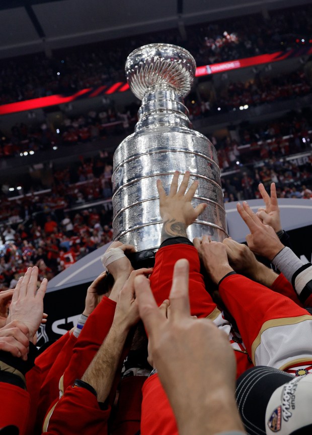 The Florida Panthers hold the Stanley Cup after Game 6 of the Stanley Cup Final, Tuesday, June 17, 2025, at Amerant Bank Arena in Sunrise, Fla. (Joe Cavaretta/South Florida Sun Sentinel)