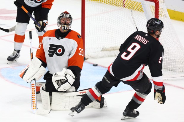 Buffalo Sabres center Josh Norris shoots the puck past Philadelphia Flyers goaltender Samuel Ersson during the third period of an NHL hockey game Thursday, Dec. 18, 2025, in Buffalo, N.Y. (AP Photo/Jeffrey T. Barnes)