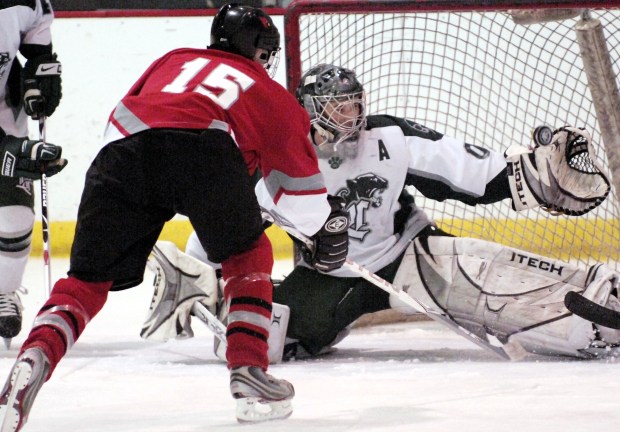 Lake Catholic goaltender Alex Guest eyes a save during a 2009 game against Mentor. (News-Herald file)