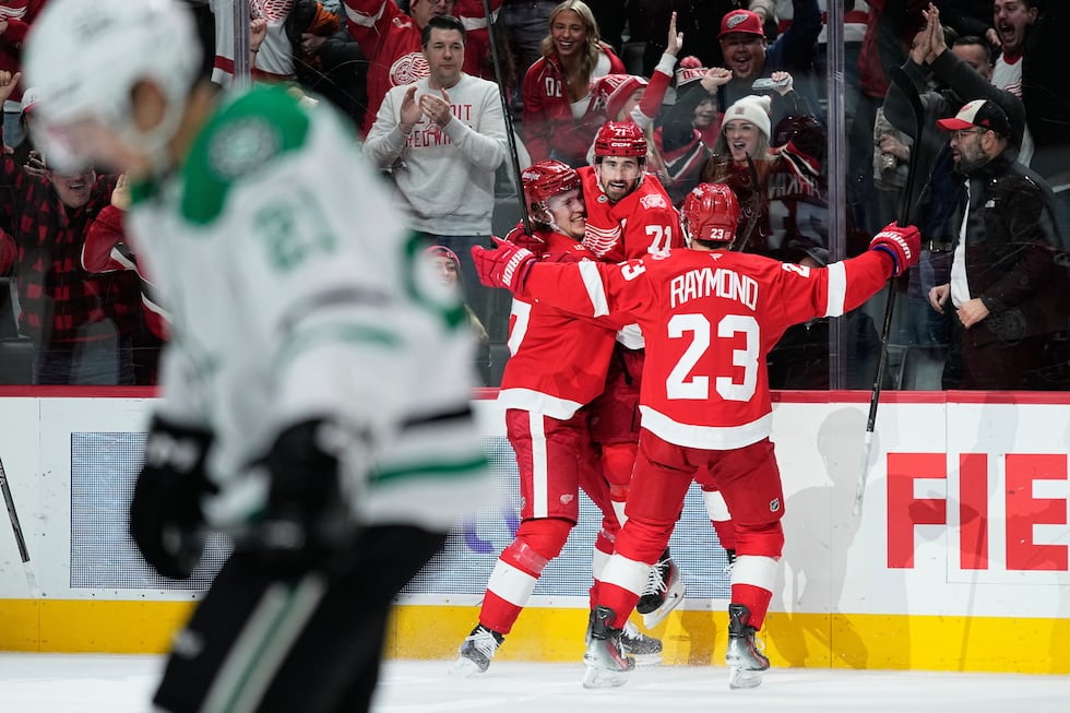 Detroit Red Wings center Dylan Larkin, third from left, celebrates scoring the winning goal...