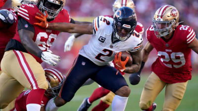 Dec 8, 2024; Santa Clara, California, USA; Chicago Bears wide receiver DJ Moore (2) runs with the ball between San Francisco 49ers defensive tackle Evan Anderson (69) and safety Talanoa Hufanga (29) in the third quarter at Levi's Stadium.