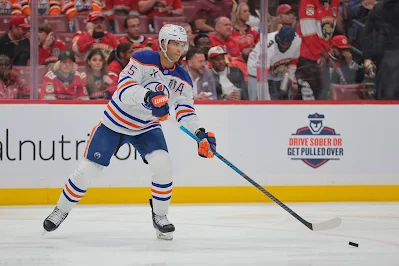Edmonton Oilers defenseman Darnell Nurse shoots the puck during 2025 game. Edmonton Oilers defenseman Darnell Nurse shoots the puck during 2025 game.