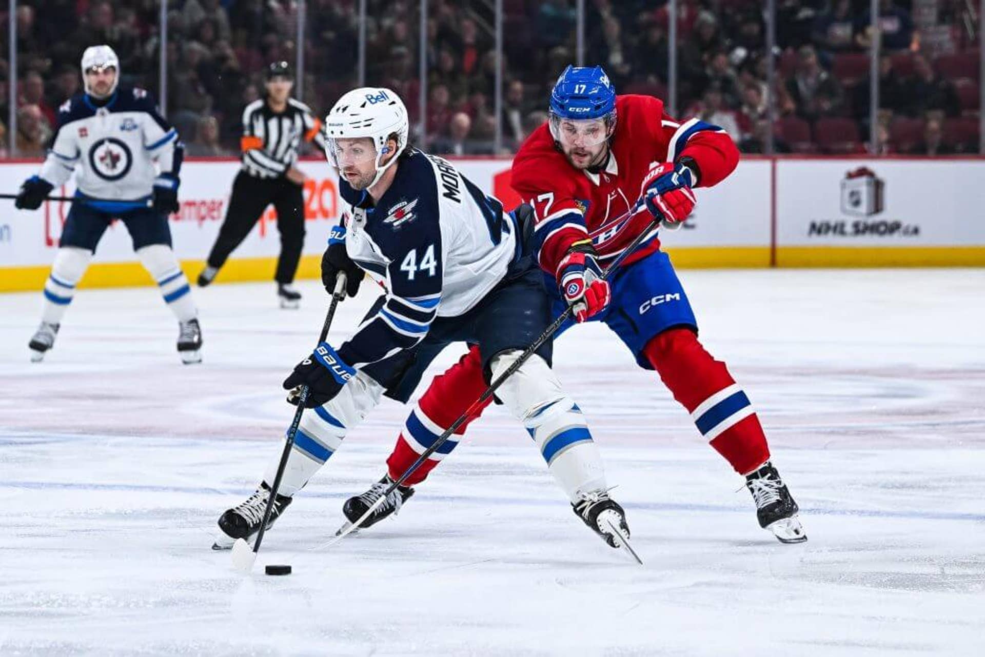 Winnipeg's Josh Morrissey controls the puck against Montreal's Josh Anderson.