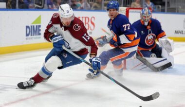 Colorado Avalanche right wing Valeri Nichushkin (13) plays the puck against New York Islanders defenseman Tony Deangelo (77) and goaltender Ilya Sorokin (30) during the third period at UBS Arena. Mandatory Credit: Brad Penner-Imagn Images