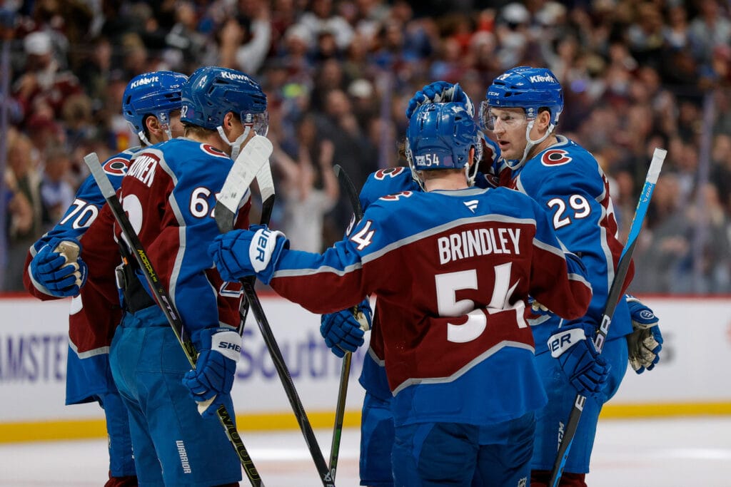 Colorado Avalanche center Nathan MacKinnon (29) celebrates his goal with center Gavin Brindley (54) and left wing Artturi Lehkonen (62) and defenseman Sam Malinski (70) and defenseman Samuel Girard (49) in the second period against the Florida Panthers at Ball Arena. Mandatory Credit: Isaiah J. Downing-Imagn Images