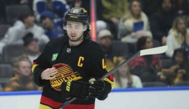 Quinn Hughes with Minnesota Wild. Kiefer Sherwood with Canucks