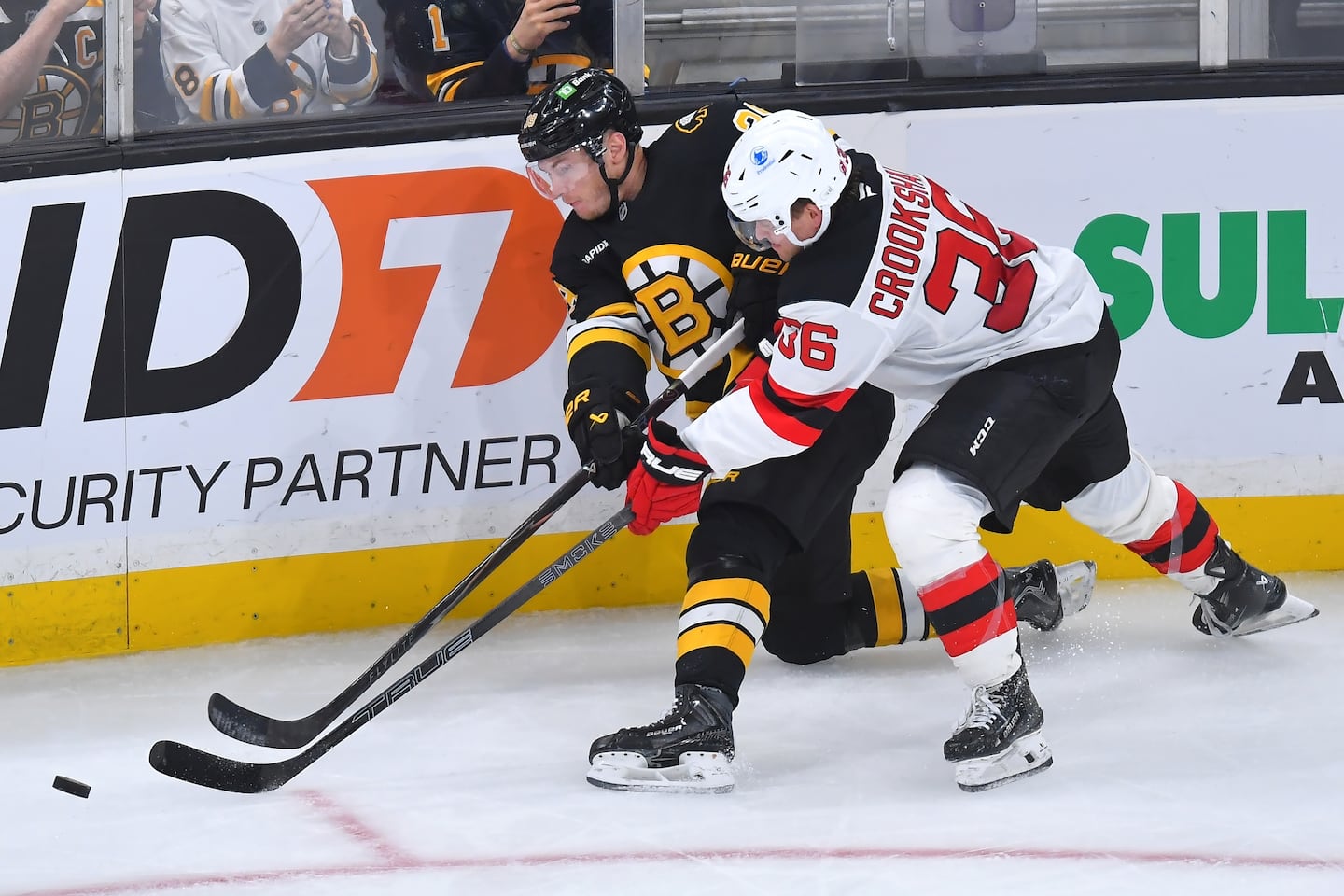 Bruins center Morgan Geekie (left)  and Devils forward Angus Crookshank pursue the puck in the third period of Boston's win. Geekie scored his 22nd goal of the season.
