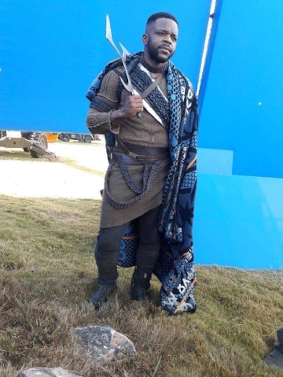 Actor Frank Monroe photographed as Wakanda warrior in Black Panther films.