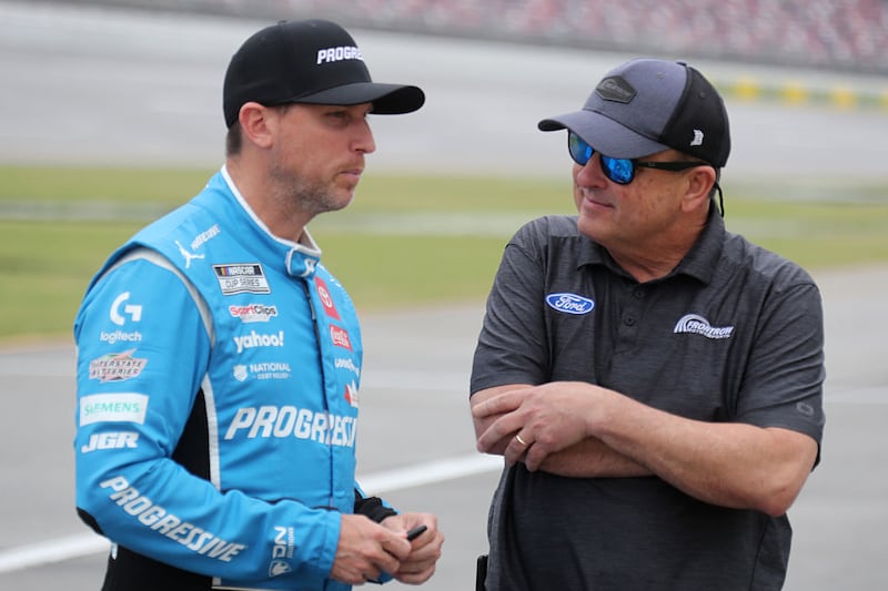 Denny Hamlin (#11 Joe Gibbs Racing Progressive Toyota) talks with Front Row Motorsports owner Bob Jenkins