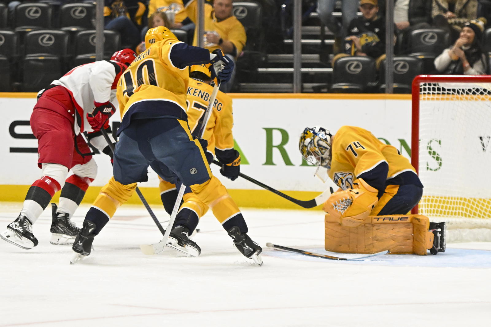 Dec 17, 2025; Nashville, Tennessee, USA; Nashville Predators goaltender Juuse Saros (74) blocks the shot of Carolina Hurricanes right wing Jackson Blake (53) during the second period at Bridgestone Arena. Mandatory Credit: Steve Roberts-Imagn Images