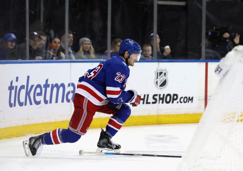 Adam Fox of the New York Rangers is injured during the game against the Tampa Bay Lightning.