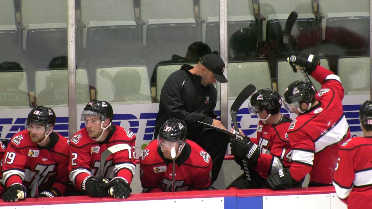 adirondack thunder players on bench during training camp workout