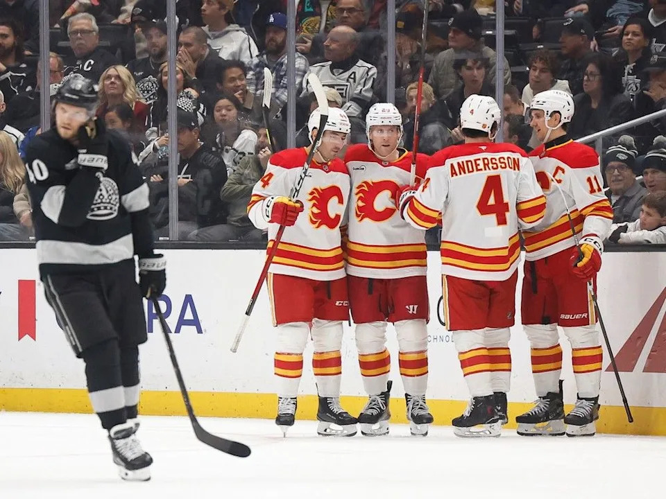  Forward Blake Coleman (second from left among the Flames players) is greeted by teammates after scoring during the second period on Saturday.