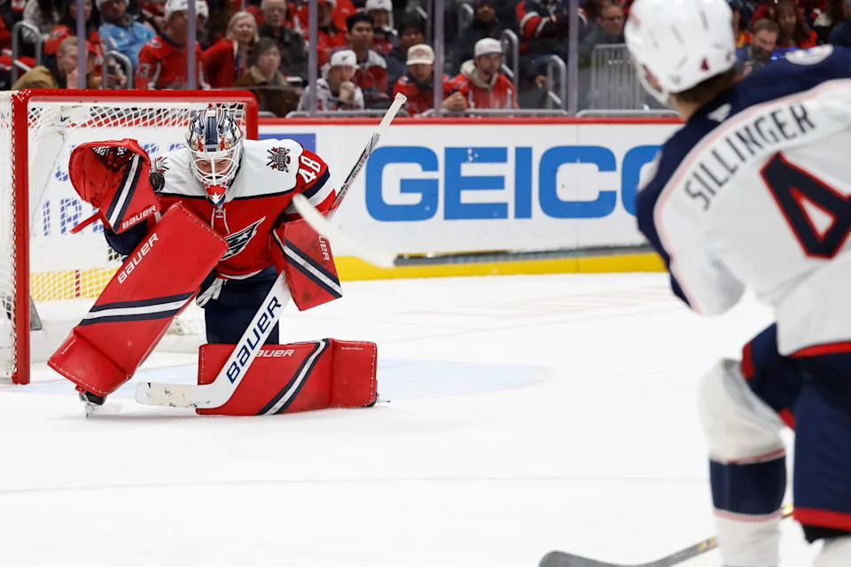 Dec 7, 2025; Washington, District of Columbia, USA; Washington Capitals goaltender Logan Thompson (48) makes a save on a shot by Columbus Blue Jackets center Cole Sillinger (4) during the second period at Capital One Arena. Mandatory Credit: Geoff Burke-Imagn Images