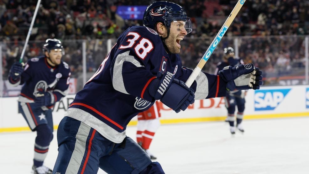Columbus Blue Jackets' Boone Jenner celebrates their goal against the Detroit Red Wings during the second period of the Stadium Series NHL hockey game at Ohio Stadium, Saturday, March 1, 2025, in Columbus, Ohio. (AP Photo/Jay LaPrete)