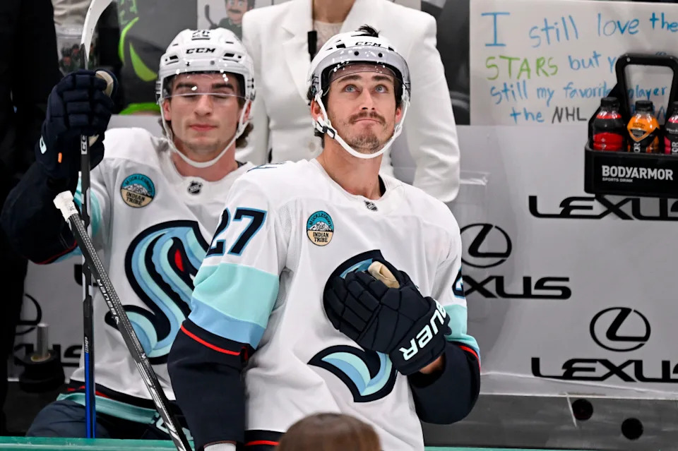 Seattle Kraken left wing Mason Marchment (27) motions to the fans as the Dallas Stars play a tribute video to him.Jerome Miron-Imagn Images