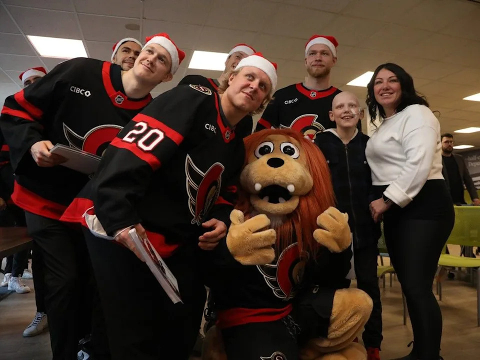  Preston Renaud, 11 years old, is photographed with the Ottawa Senators during their annual their annual trip to the Children’s Hospital of Eastern Ontario (CHEO) to spread festive cheer, December 08, 2025.