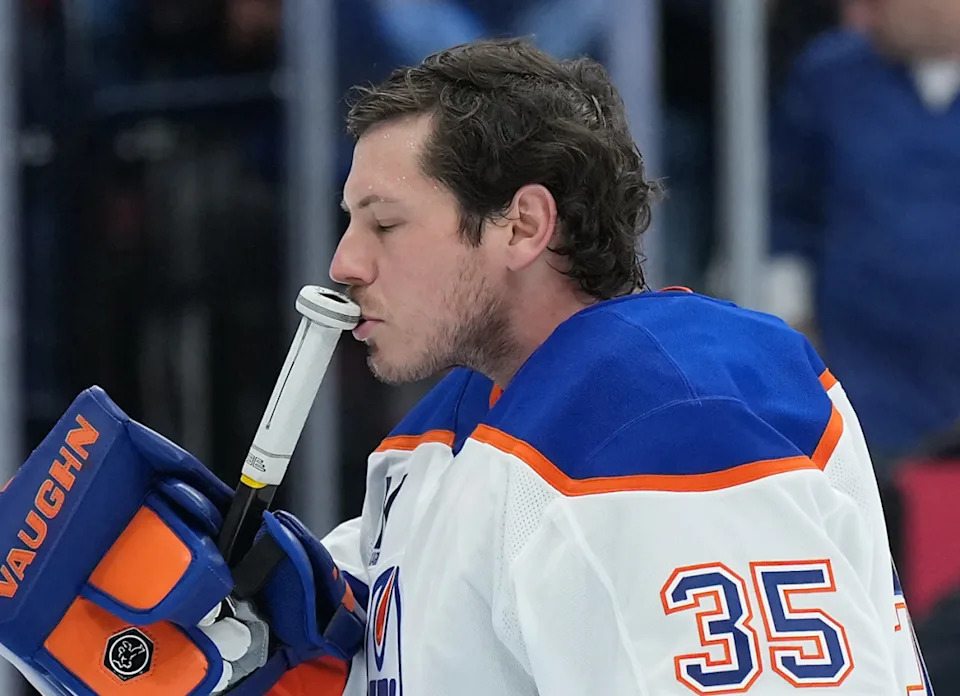 Edmonton Oilers goaltender Tristan Jarry (35) kisses his goal stick before the start of the first period against the Toronto Maple Leafs at Scotiabank Arena.Nick Turchiaro-Imagn Images