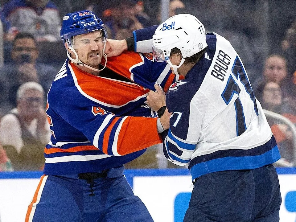 The Edmonton Oilers’ Josh Brown (44) fights the Winnipeg Jets’ Tyrel Bauer (77) during second period preseason NHL action at Rogers Place, in Edmonton Friday Sept. 26, 2025. Photo by David Bloom