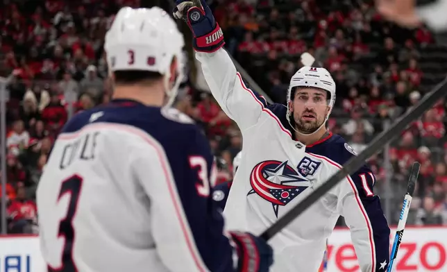 Columbus Blue Jackets' Miles Wood celebrates his goal during the third period of an NHL hockey game against the New Jersey Devils in Newark, N.J., Monday, Dec. 1, 2025. (AP Photo/Seth Wenig)
